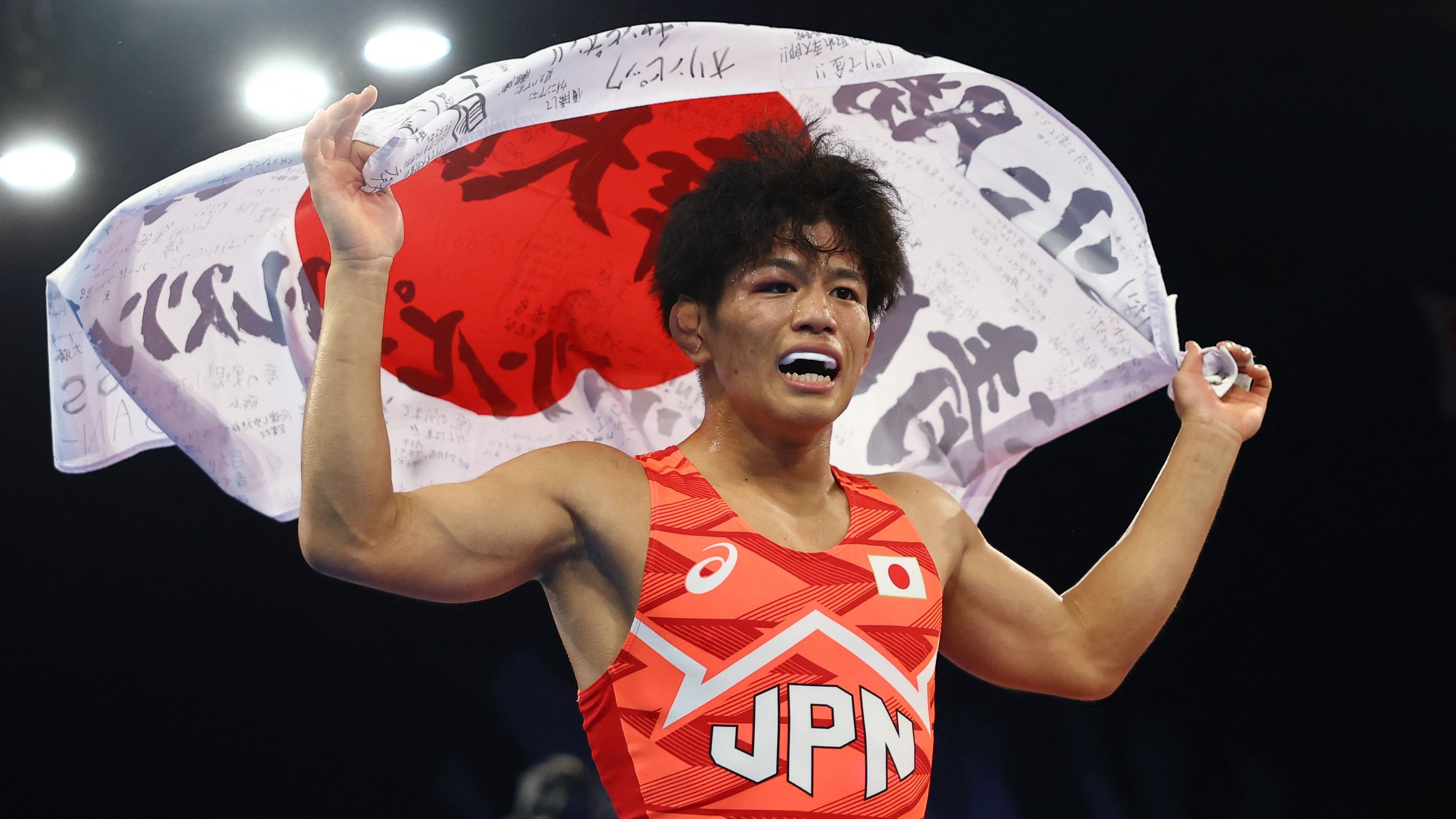 <div class="paragraphs"><p>Kotaro Kiyooka of Japan celebrates winning gold in the match against Rahman Amouzadkhalili of Iran.</p></div>